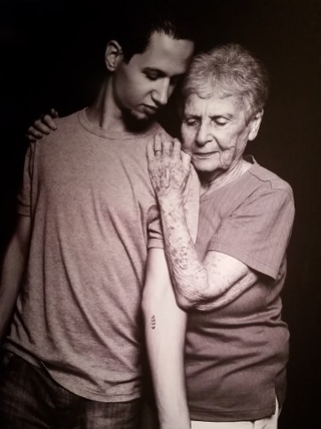 Photograph by Uriel Sinai of Daniel Philosoph and Livia Ravek. Israelis have voluntarily gotten tattoos of their relatives' imprisonment numbers as a symbol of remembrance and honor.